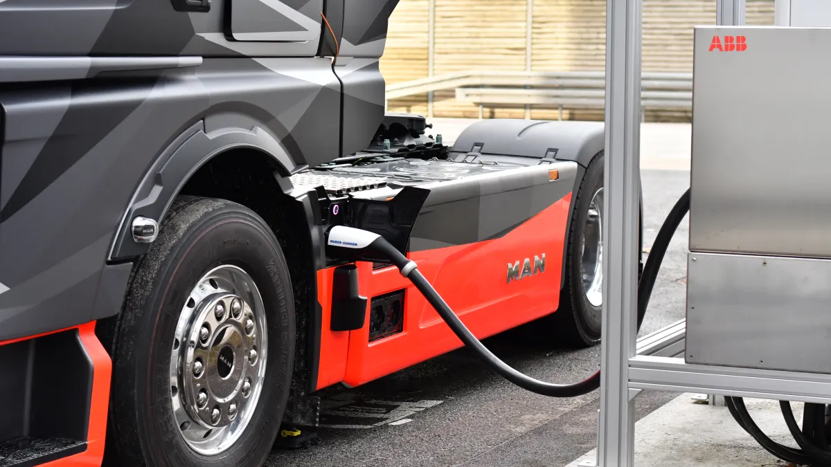 The picture shows an MAN eTruck charging at a proof of concept charger of ABB E-mobility