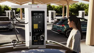 Woman in front of A400 charging her car